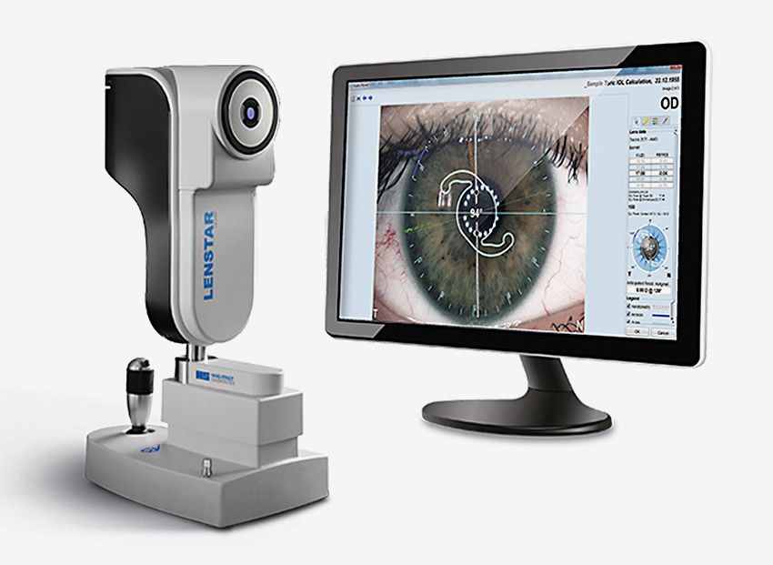 On left is the Lenstar 900 biometer; on right is a computer monitor with a close-up of an eye being measured for pre-operative and post-operative characteristics.