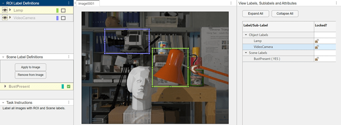 Image with labeled objects and scene. Lamp and video camera are labeled with green and blue rectangles. The presence of a bust is indicated with the scene label.