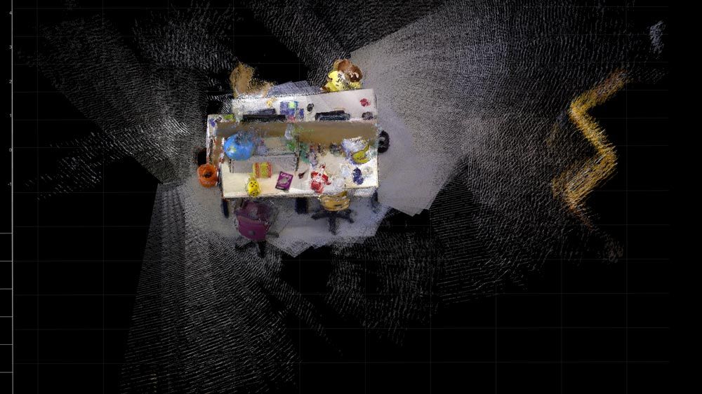 Dichte Rekonstruktion einer Szene durch die Anwendung von visuellem SLAM auf Daten von einer RGB-D-Kamera.